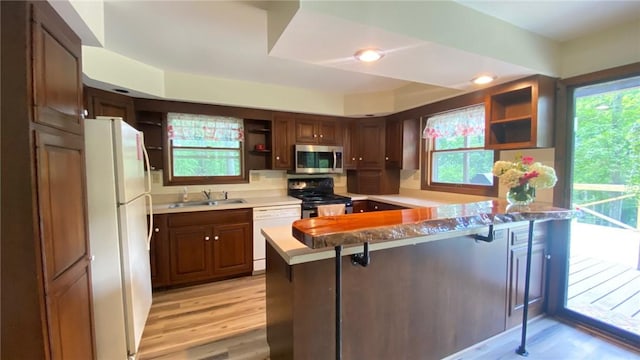 1221 Garden Ln, Middlesex, NY 14507 - kitchen with appliances with stainless steel finishes, open shelves, a peninsula, plenty of natural light, and recessed lighting