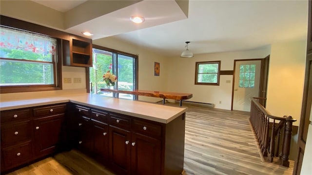 1221 Garden Ln, Middlesex, NY 14507 - kitchen featuring light countertops, light wood-style floors, plenty of natural light, and a peninsula