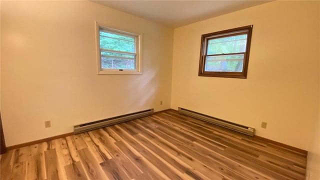 1221 Garden Ln, Middlesex, NY 14507 - empty room with a baseboard radiator, plenty of natural light, and light wood-style floors