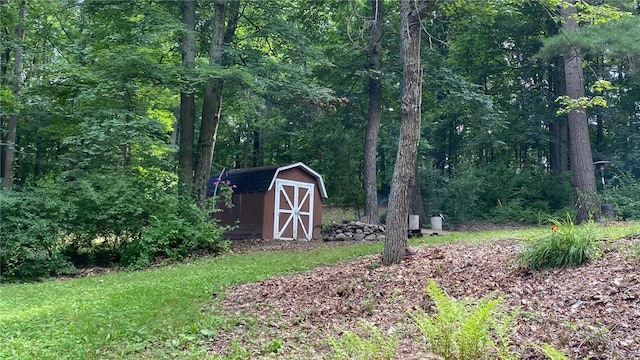 1221 Garden Ln, Middlesex, NY 14507 - view of yard with a storage unit and a forest view