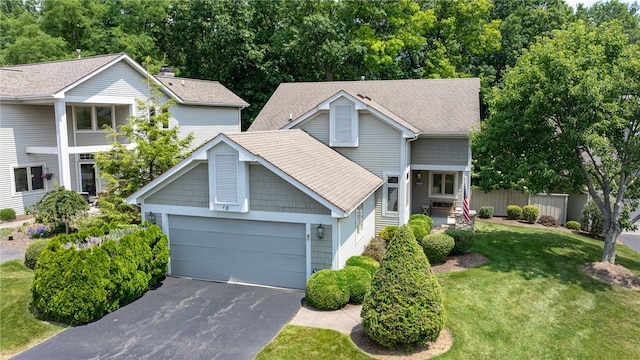 10 Bristol View Dr, Perinton, NY 14450 - view of front facade featuring asphalt driveway, a garage, and roof with shingles