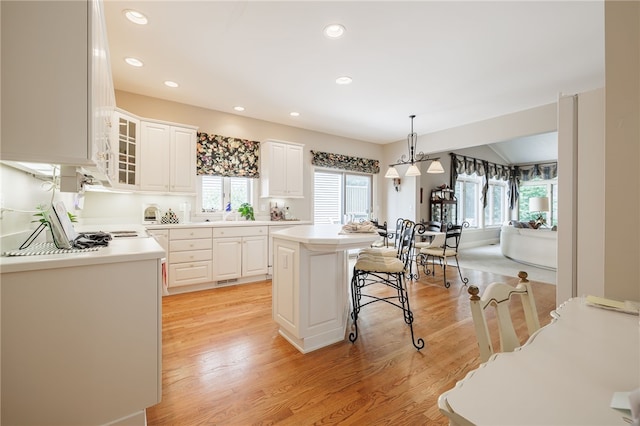10 Bristol View Dr, Perinton, NY 14450 - kitchen with plenty of natural light, white cabinets, glass insert cabinets, and recessed lighting