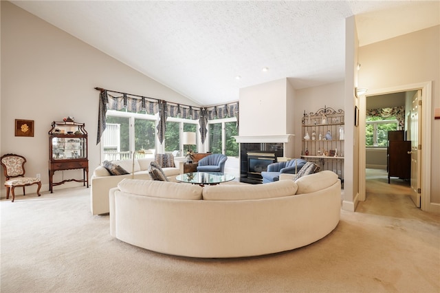 10 Bristol View Dr, Perinton, NY 14450 - living area with light carpet, a fireplace, a textured ceiling, and high vaulted ceiling