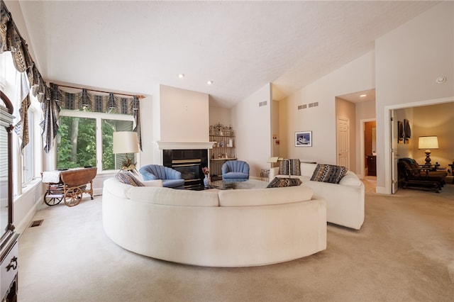 10 Bristol View Dr, Perinton, NY 14450 - living area featuring light carpet, a tiled fireplace, recessed lighting, and high vaulted ceiling