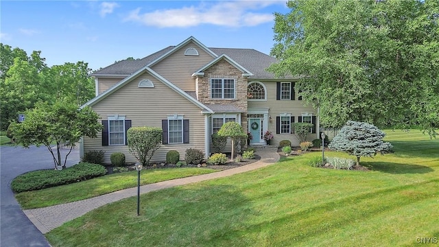 1002 Oreste St, Camillus, NY 13031 - view of front of home featuring a front yard and stone siding
