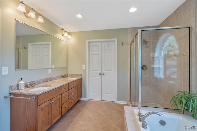 1002 Oreste St, Camillus, NY 13031 - bathroom with double vanity, a garden tub, a shower stall, tile patterned flooring, and recessed lighting
