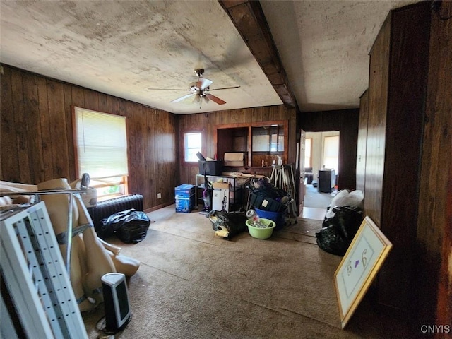 312 Richmond Ave Unit 314, Syracuse, NY 13204 - interior space featuring wood walls, carpet, ceiling fan, and beamed ceiling