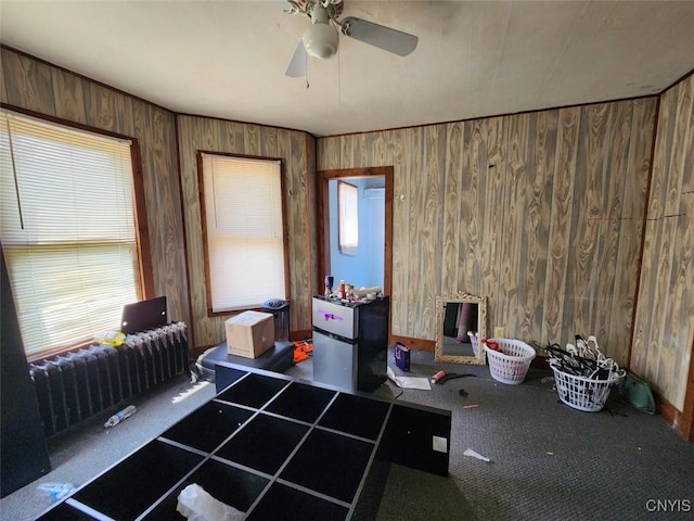 312 Richmond Ave Unit 314, Syracuse, NY 13204 - home office with a ceiling fan, wood walls, and radiator
