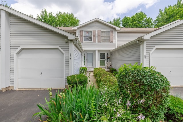 134 Jordache Ln, Ogden, NY 14559 - view of front of home featuring an attached garage and asphalt driveway