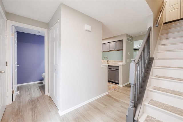 134 Jordache Ln, Ogden, NY 14559 - stairway with wood finished floors and baseboards
