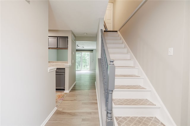 134 Jordache Ln, Ogden, NY 14559 - stairs featuring baseboards and wood finished floors