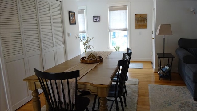 164 S Fitzhugh St, Rochester, NY 14608 - dining space with light wood finished floors and baseboards