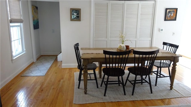 164 S Fitzhugh St, Rochester, NY 14608 - dining area featuring baseboards and light wood-type flooring