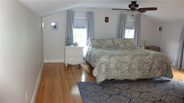 164 S Fitzhugh St, Rochester, NY 14608 - bedroom featuring wood finished floors, vaulted ceiling, multiple windows, and a ceiling fan