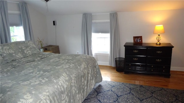 164 S Fitzhugh St, Rochester, NY 14608 - bedroom featuring wood finished floors and vaulted ceiling