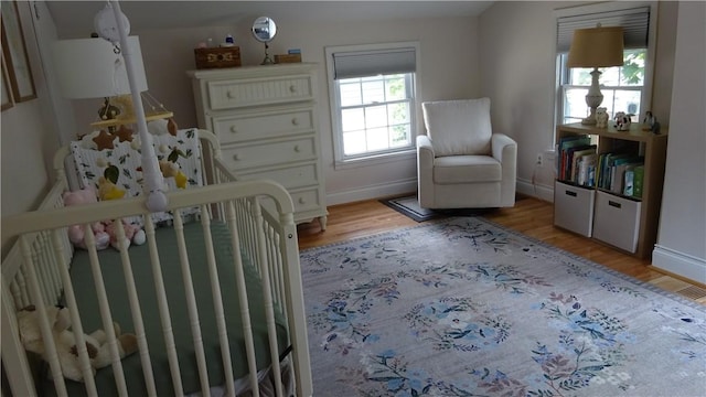 164 S Fitzhugh St, Rochester, NY 14608 - bedroom featuring light wood finished floors and baseboards