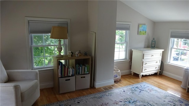 164 S Fitzhugh St, Rochester, NY 14608 - sitting room with wood finished floors and lofted ceiling