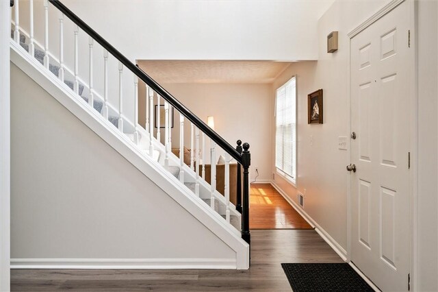 45 Hazel Bark, Gates, NY 14606 - foyer with wood finished floors and stairway