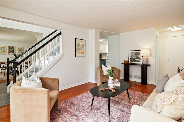 45 Hazel Bark, Gates, NY 14606 - living area featuring wood finished floors, stairway, and a textured ceiling