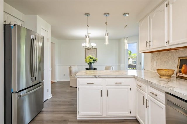 45 Hazel Bark, Gates, NY 14606 - kitchen featuring stainless steel appliances, a peninsula, white cabinetry, wood finished floors, and a chandelier