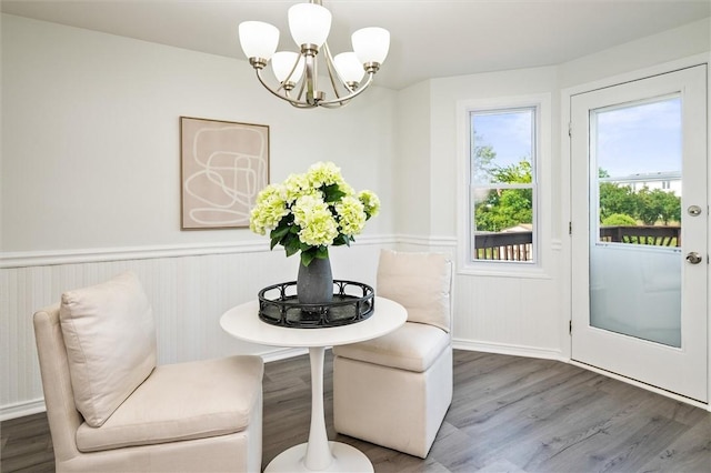 45 Hazel Bark, Gates, NY 14606 - dining space with a chandelier, wood finished floors, and a wainscoted wall