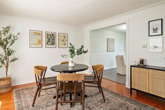 45 Hazel Bark, Gates, NY 14606 - dining space featuring wood finished floors, crown molding, and a textured ceiling
