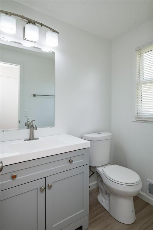45 Hazel Bark, Gates, NY 14606 - half bathroom with wood finished floors and vanity