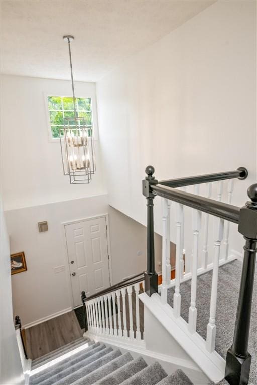 45 Hazel Bark, Gates, NY 14606 - staircase featuring a chandelier