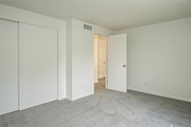 45 Hazel Bark, Gates, NY 14606 - unfurnished bedroom featuring carpet floors and a closet