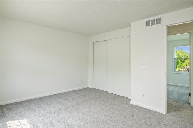 45 Hazel Bark, Gates, NY 14606 - unfurnished bedroom with carpet flooring and a closet