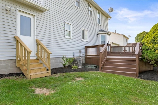 45 Hazel Bark, Gates, NY 14606 - back of property with a lawn and a wooden deck