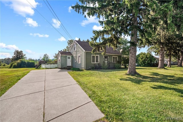 4034 Burke Pkwy, Hamburg, NY 14219 - view of front of property featuring concrete driveway and a front lawn