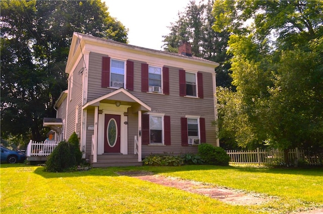 132 Main St, Unadilla, NY 13849 - colonial home featuring a chimney and cooling unit