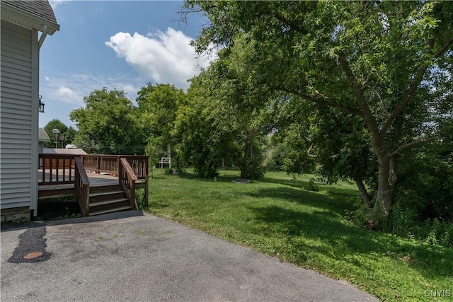 15243 Factory St, Clayton, NY 13632 - view of green lawn featuring a wooden deck
