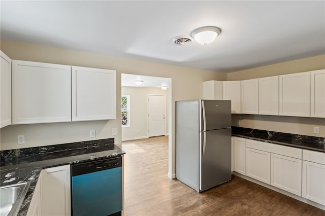 1728 Dalton Rd, Lima, NY 14485 - kitchen with freestanding refrigerator, dishwashing machine, dark wood-type flooring, and white cabinets