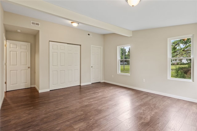 1728 Dalton Rd, Lima, NY 14485 - unfurnished bedroom featuring multiple windows, dark wood-style floors, and a closet