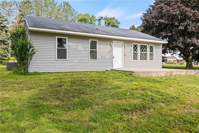 1728 Dalton Rd, Lima, NY 14485 - back of house with a yard, a chimney, a patio area, and a shingled roof