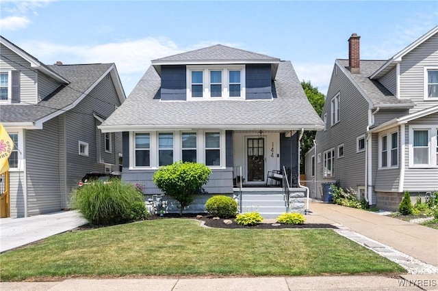 144 Whitfield Ave, Buffalo, NY 14220 - bungalow-style house featuring a shingled roof, a porch, and a front yard