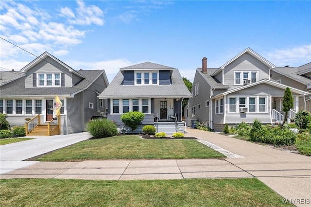 144 Whitfield Ave, Buffalo, NY 14220 - bungalow-style home with a porch, a front yard, roof with shingles, and concrete driveway