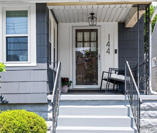 144 Whitfield Ave, Buffalo, NY 14220 - doorway to property with a porch