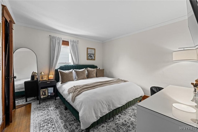 144 Whitfield Ave, Buffalo, NY 14220 - bedroom featuring ornamental molding and wood finished floors