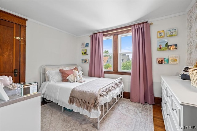 144 Whitfield Ave, Buffalo, NY 14220 - bedroom featuring crown molding and light wood-style flooring