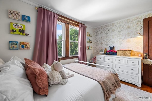 144 Whitfield Ave, Buffalo, NY 14220 - bedroom with crown molding, wallpapered walls, and wood finished floors