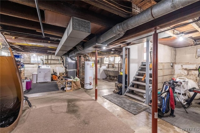 144 Whitfield Ave, Buffalo, NY 14220 - basement featuring gas water heater, washer and clothes dryer, and heating unit