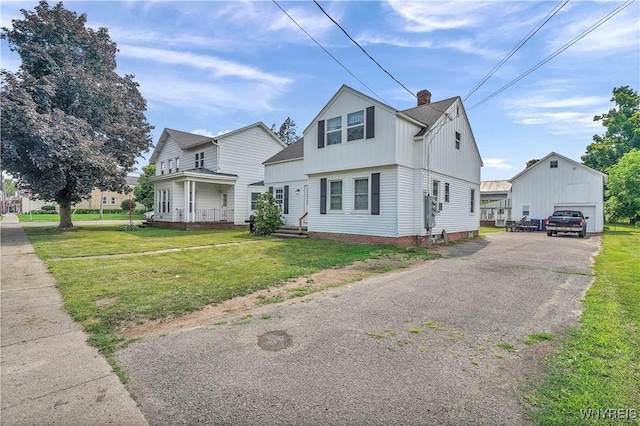 10470 Main St, North Collins, NY 14111 - view of front of property with a chimney, an outbuilding, a front lawn, board and batten siding, and a garage