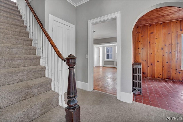 10470 Main St, North Collins, NY 14111 - staircase with arched walkways, ornamental molding, carpet, and wooden walls