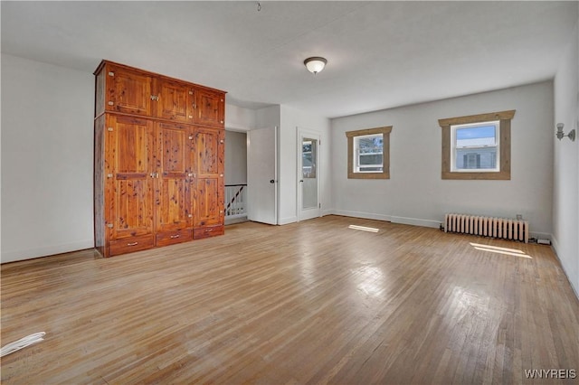 10470 Main St, North Collins, NY 14111 - unfurnished bedroom featuring radiator and light wood finished floors