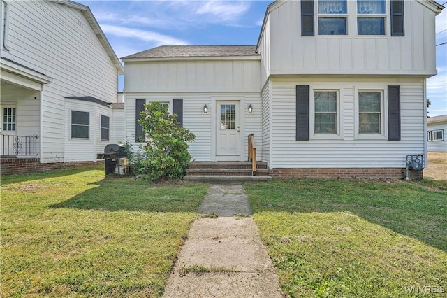 10470 Main St, North Collins, NY 14111 - colonial inspired home with board and batten siding, a front lawn, and entry steps