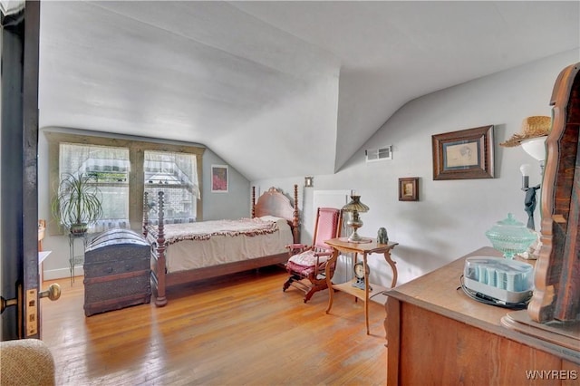 10470 Main St, North Collins, NY 14111 - bedroom featuring light wood finished floors and vaulted ceiling