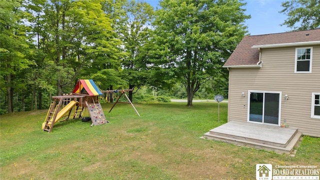 2777 S Roberts Rd, Sheridan, NY 14063 - view of green lawn featuring a playground and a deck
